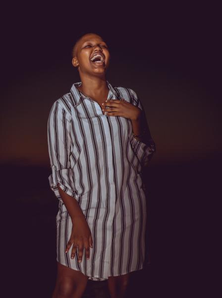 Woman laughing in Mauritius, by Ekoate Nwaforlor