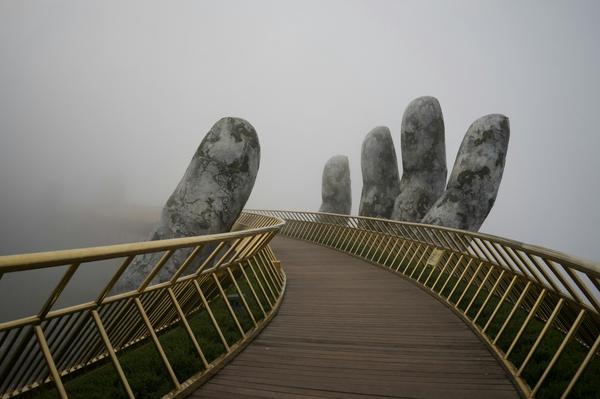Bridge supported by hand sculpture Bridge supported by hand sculpture