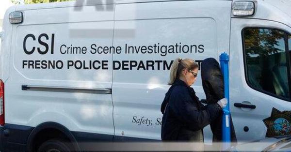 Fresno police Investigator Brooke Passmore heads to the scene on Lamona Ave. where a shooting took place at a house party which involved multiple fatalities and injuries in Fresno, Calif., Monday, Nov. 18, 2019.