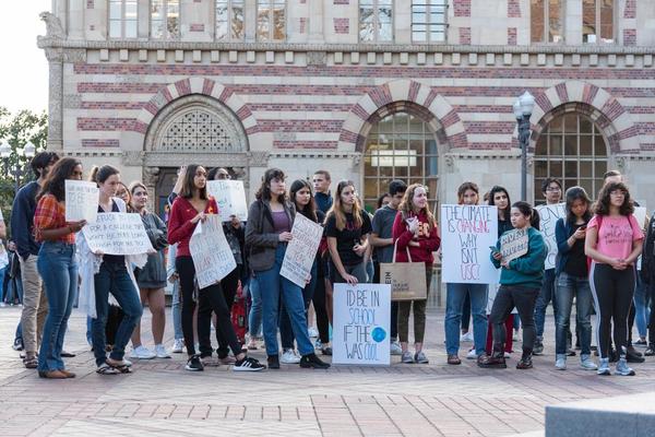 Student environmental groups led the protest with chants of “Divest! Divest! It’s in our best interest” as protestors held signs with slogans such as “No time for fossil fools.”