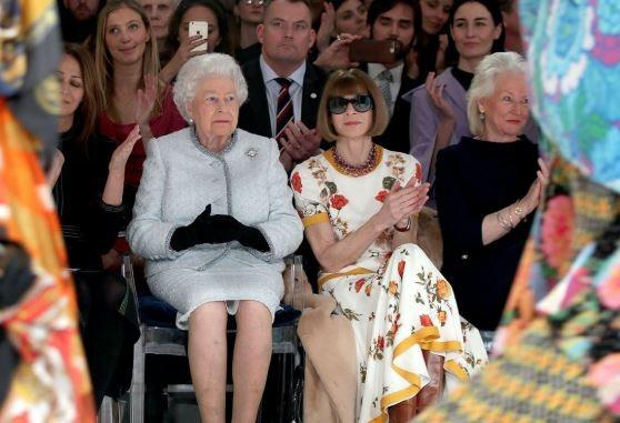 Queen Elizabeth II and Anna Wintour attend the Richard Quinn show during London Fashion Week February 2018 on February 20, 2018 in London, England