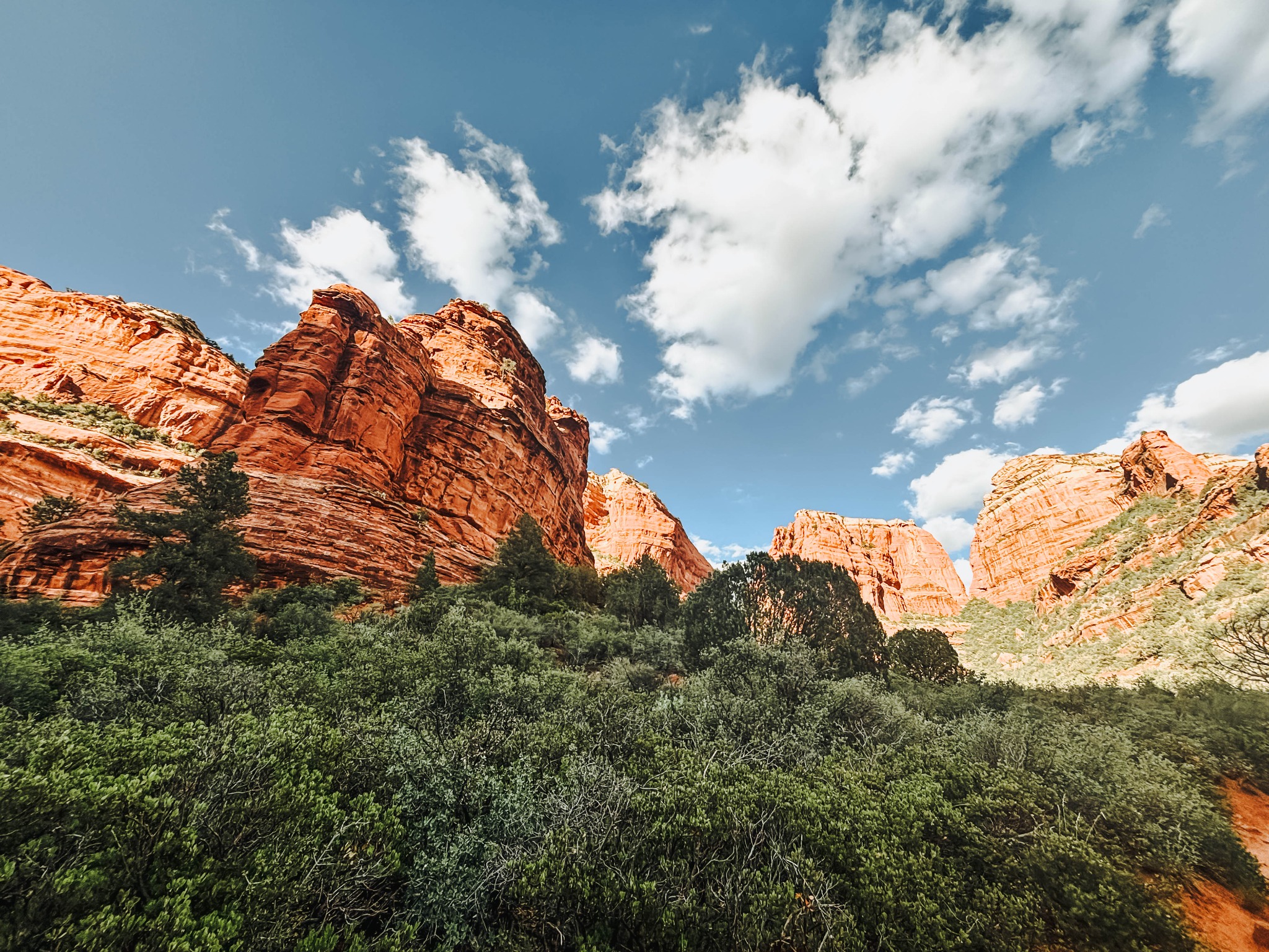 Red rock mountain landscape in Sedona, Arizona with blue sky and clouds