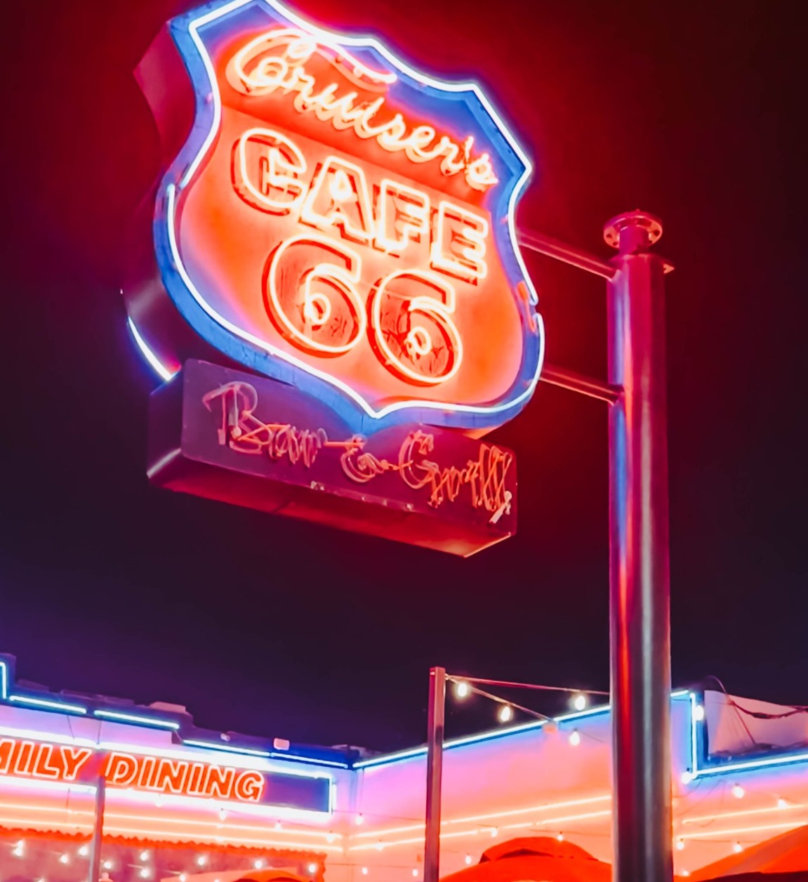 Family outside Cruiser's Cafe 66 along Route 66 in Williams, Arizona