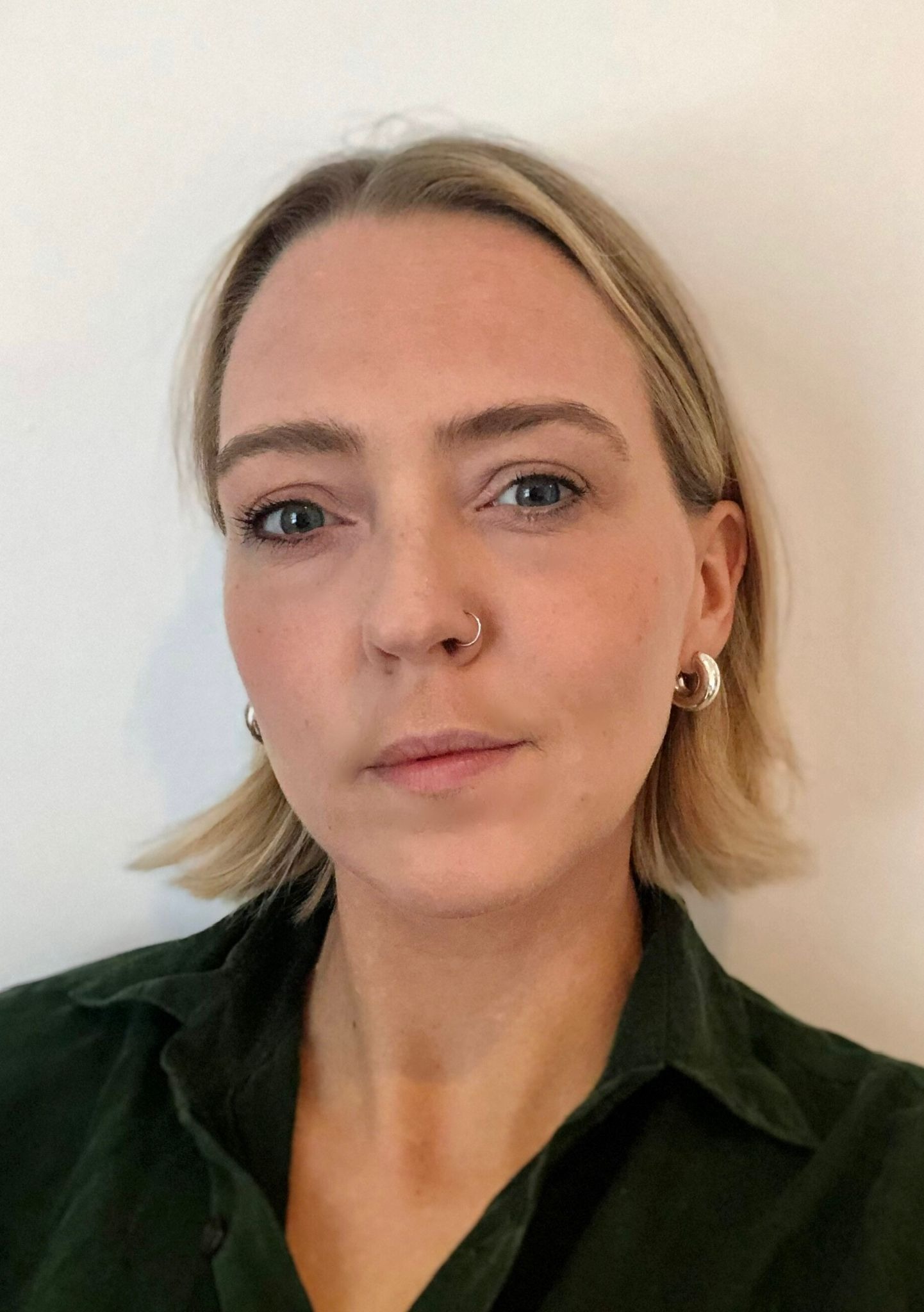 Evie Breese: Pofile of  a white woman in early 30s with short blonde hair