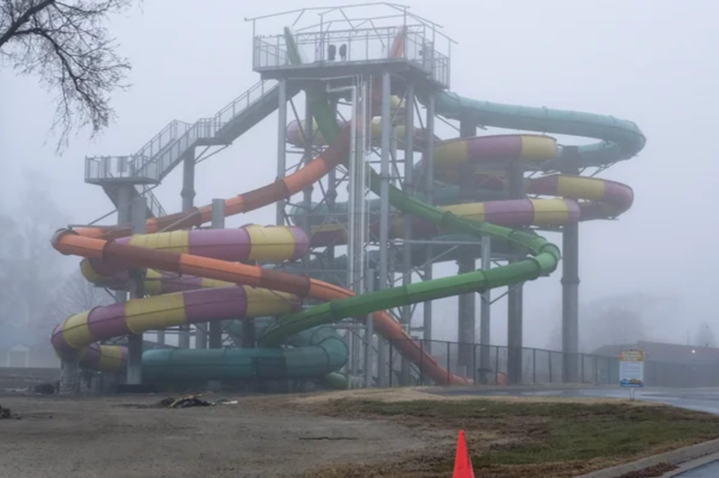 A waterslide sits in the fog