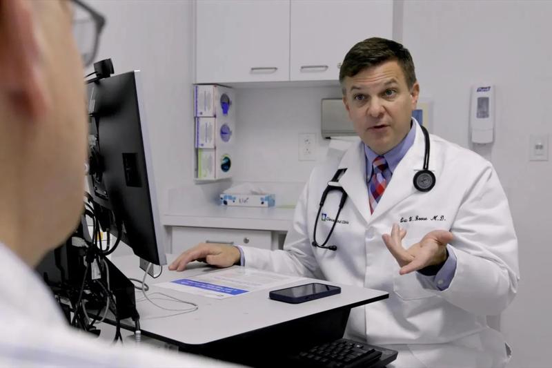 Eric Boose, a family medicine physician, uses AI software to document a patient’s appointment. (Cleveland Clinic)