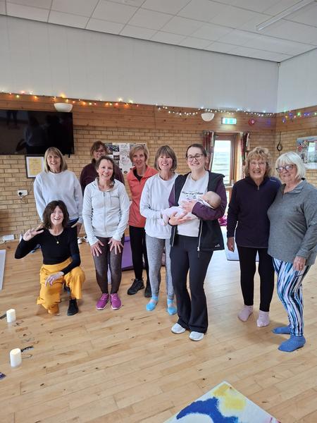 DaisychainYoga community, class with newborn baby in yoga hall