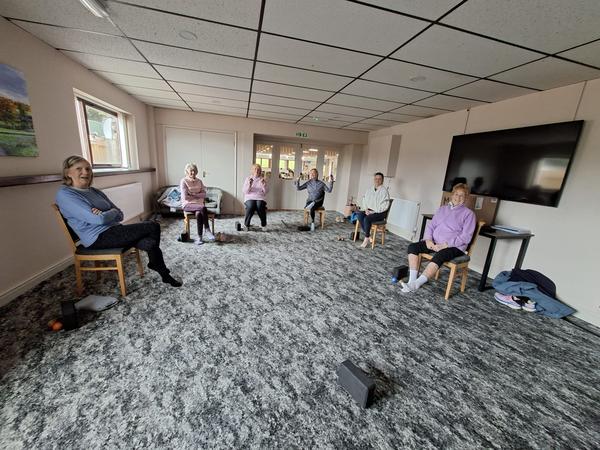 Chair-based yoga class for older adults in South Lincolnshire by Daisychain Yoga, gentle group session improving mobility, balance and strength.