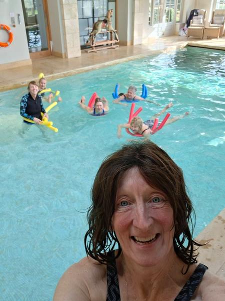 Rachel Metcalfe leading a fun Aqua Yoga session with students at the Honington Grange pool.