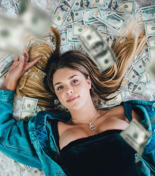 Woman lying in a pile of money