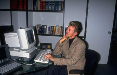 Rock star David Bowie working on desktop computer in office. © Time Inc. Rock star David Bowie working on desktop computer in office. © Time Inc.