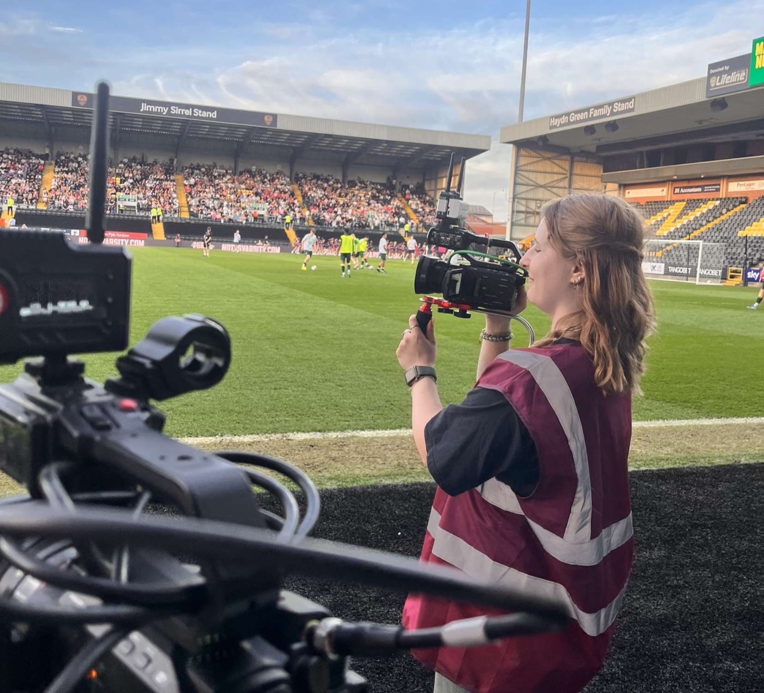 Lily Baldwin filming Nottingham Varsity at Meadow Lane Stadium