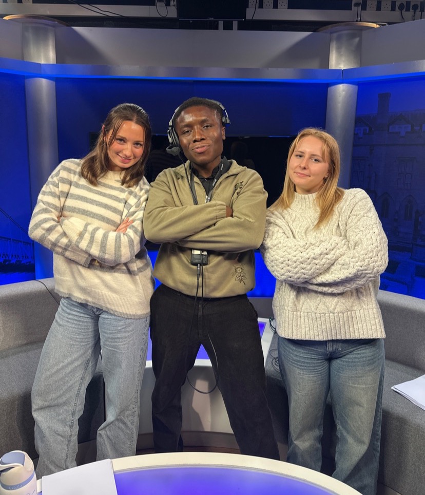 Lily Baldwin (right) with course mates at Nottingham Trent University, presenting the news
