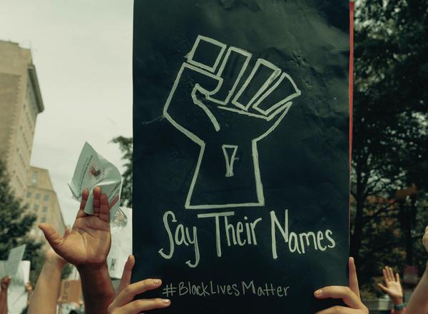 A woman holds up a sign at the Black Lives Matter protest in Washington, D.C