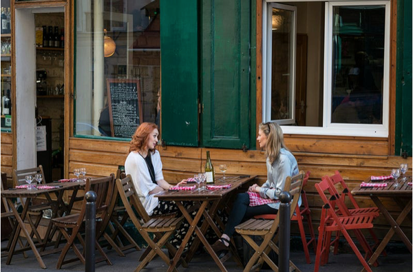 Two women at a cafe in Paris