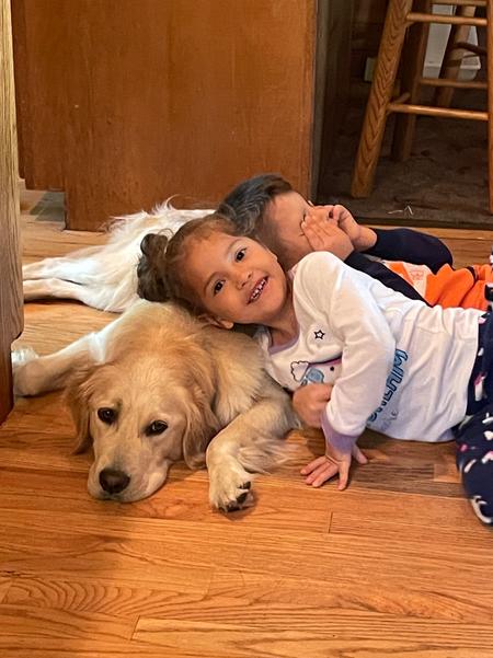 brother and sister loving dog