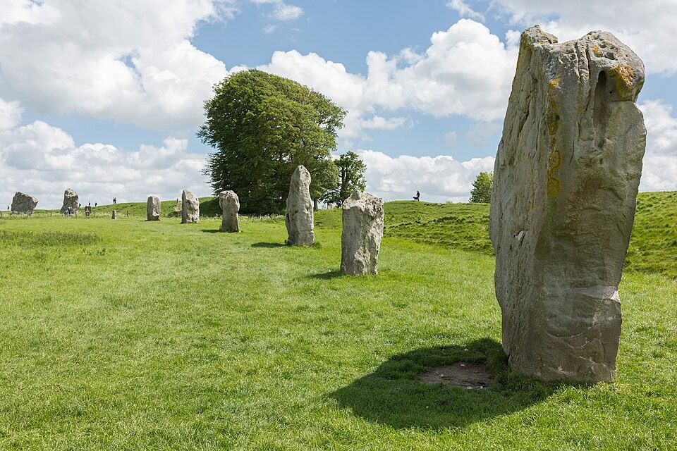 Large standing stones forming part of Avebury's South Inner Circle in Wiltshire, set within a grassy prehistoric landscape.