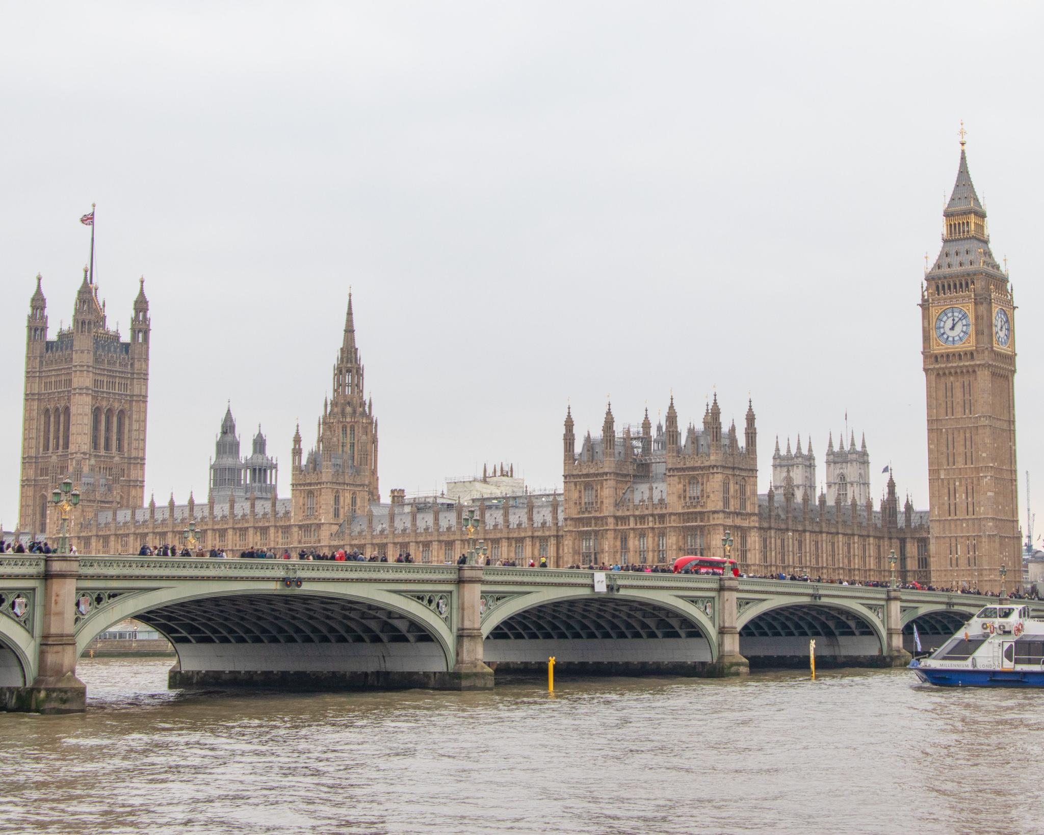 The Palace of Westminster and Elizabeth Tower beside the River Thames in London.