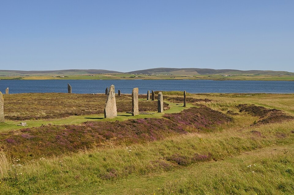 Standing stones of the Ring of Brodgar on Mainland Orkney, with the Loch of Harray visible in the background.