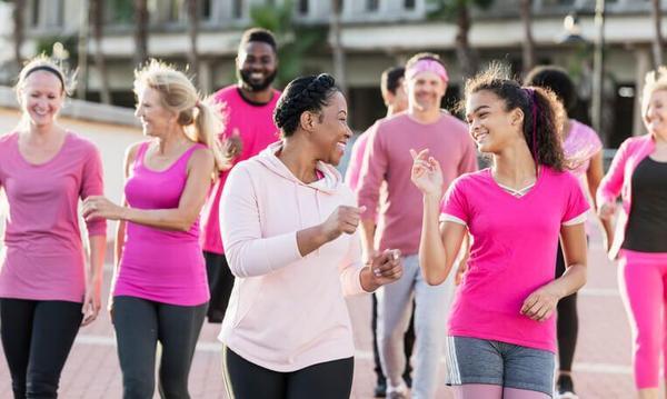 A group of people participating in a walkathon A group of people participating in a walkathon