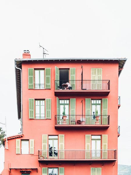 A pink apartment building A pink apartment building