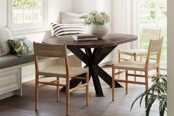 A small dining room table with three chairs and a bench A small dining room table with three chairs and a bench