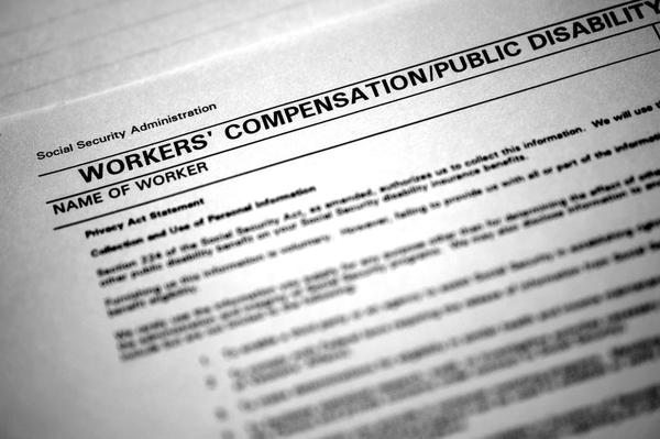 A closeup of a workers' compensation document. A closeup of a workers' compensation document.