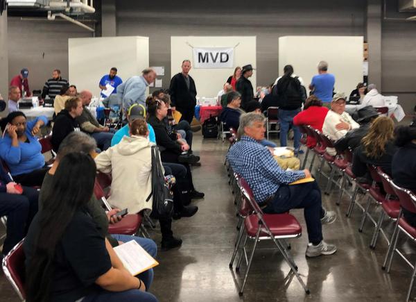 Veterans wait at a mobile MVD setup at the 2020 Maricopa County Veteran's StandDown on Jan. 24, 2020.