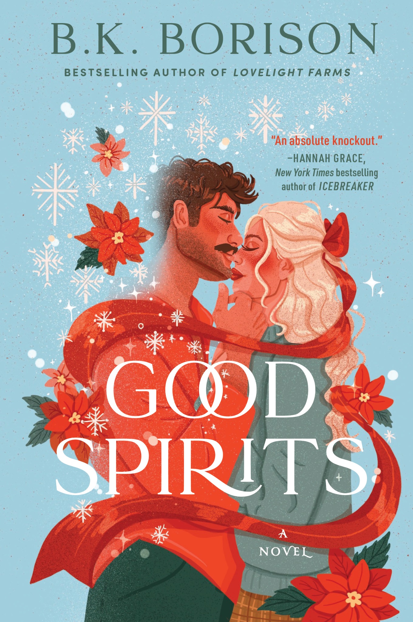 Book cover of Good Spirits by B.K. Borison. The design features a light, wintery blue background. There are two drawn characters, a male with dark brown hair and a female with long, light blonde hair. The characters stand in a wrapped embrace, with a red ribbon and poinsettias wrapping them. There are also white snowflakes above them.