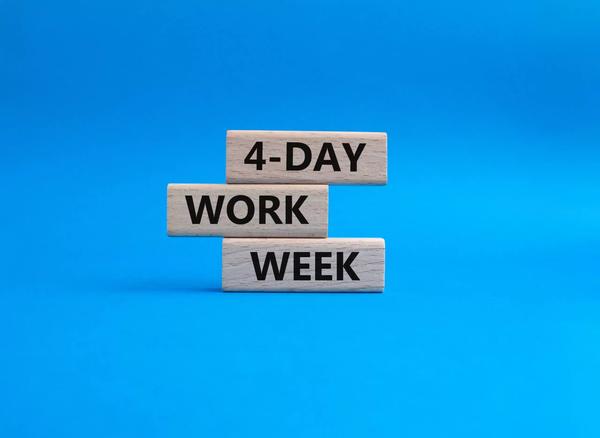 Stacked wooden blocks that read 4-Day Work Week on Clockwise's blog Stacked wooden blocks that read 4-Day Work Week on Clockwise's blog