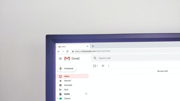 Partial screenshot of Gmail inbox window on a laptop